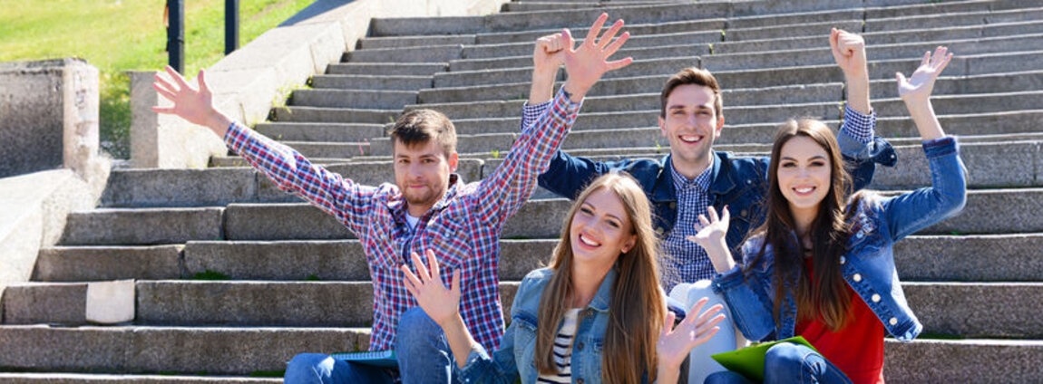 happy-students-sitting-stairs-park[1].jpg